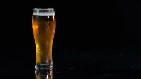 Beer. Cold Craft light Beer in a glass with water drops. Advert shot. Ad concept Stock Footage 169157696