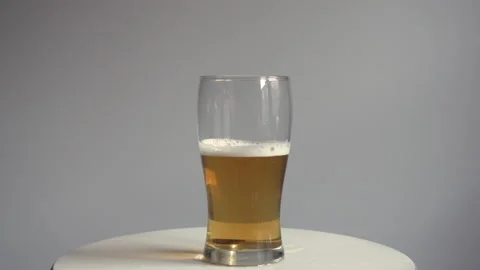 Beer draining from a glass Stock Footage 138667031