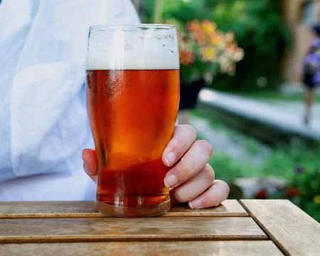 Beer drinking  at the outdoor table Stock Photos