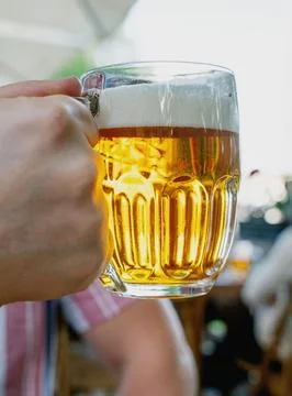 Beer drinking  at the outdoor table Stock Photos