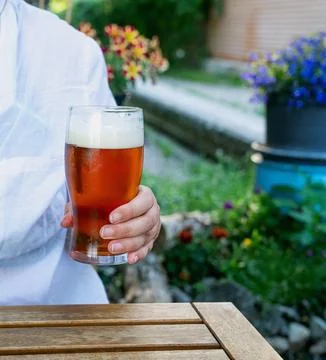 Beer drinking  at the outdoor table Stock Photos