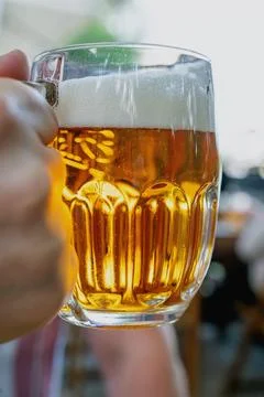 Beer drinking  at the outdoor table Stock Photos