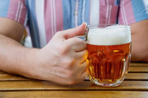 Beer drinking  at the outdoor table Stock Photos