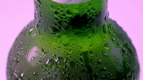 Beer drop slowly trickles down the misted beer bottle, following the camera Stock Footage 201006449