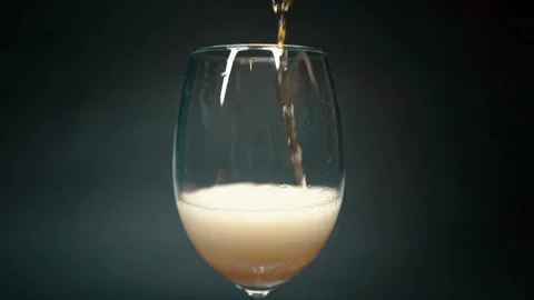 Beer on empty rosy background. Golden liquid stream 3d realistic footage. Stock Footage 265768443