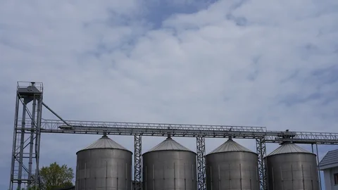 Beer factory under floating clouds above it Stock Footage 129514870