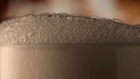 Beer  on a fire background in a dark. flame game on brown glass. slow motion Stock Footage 148042484