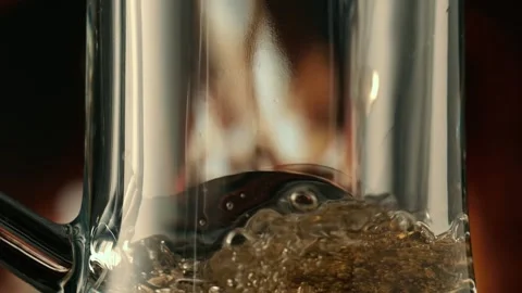 Beer  on a fire background in a dark. flame game on brown glass. slow motion Stock Footage 148042486