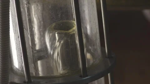 Beer flows into a glass flask Stock Footage 62434992