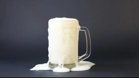 Beer foam is poured from a cup Stock Footage 3143675