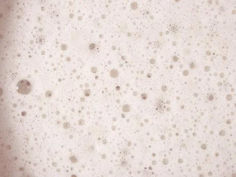 Beer foam texture close up as background. Stock Photos