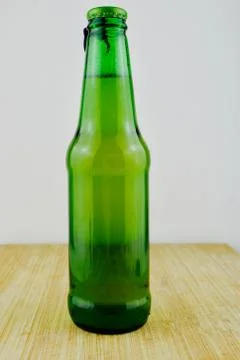 Beer in green bottle Stock Photos
