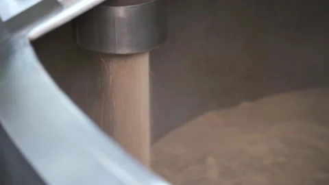 Beer making in craft brewery, Kettle with beer inside, flowing beer. Close up Stock Footage 155276807
