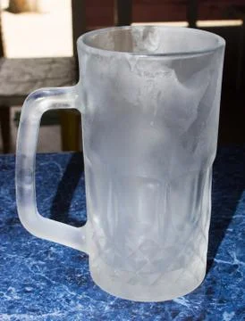 Beer mug on the bar Stock Photos