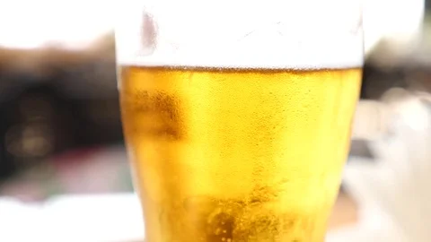 Beer in a mug close up. 4k. Slow motion, air bubbles in beer slowly rise up. Stock Footage