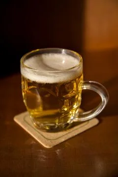 Beer mug on a coaster Foto stock