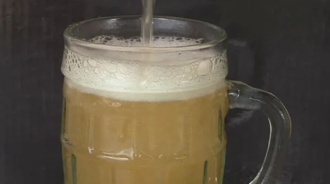 Beer mug full of cold fresh alcohol drink Stock Footage 65075956