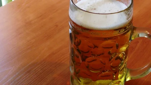 Beer mug on the table Stockbeeldmateriaal 91623422