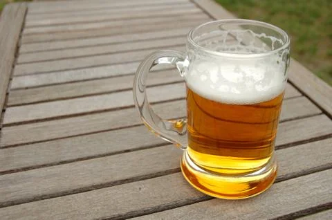 Beer mug on wooden table outdoors Stock-Fotos