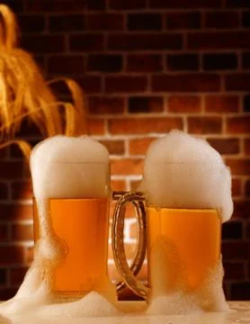 Beer mugs in a rustic setting Stock Photos