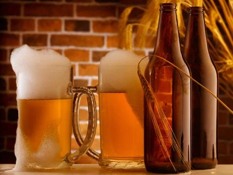 Beer mugs in a rustic setting Stock Photos
