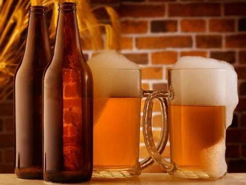 Beer mugs in a rustic setting Stock Photos