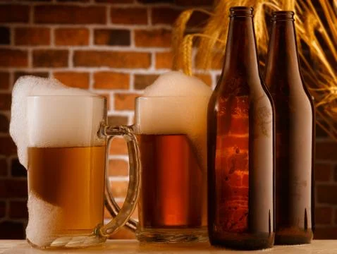 Beer mugs in a rustic setting Stock Photos