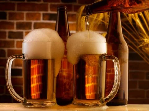 Beer mugs in a rustic setting Stock Photos