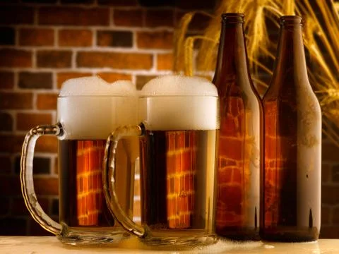Beer mugs in a rustic setting Stock Photos