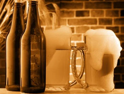 Beer mugs in a rustic setting Stock Photos
