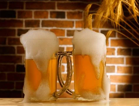 Beer mugs in a rustic setting Stock Photos