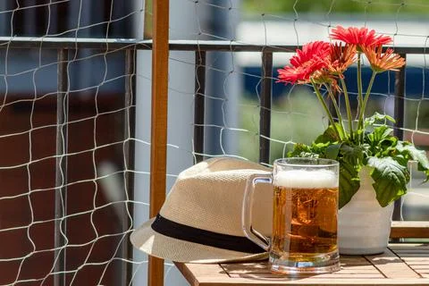 Beer Pint on the balcony while resting on a sunny day Stock Photos