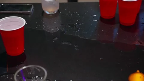 https://images.pond5.com/beer-pong-game-spilled-drink-footage-171587624_iconl.jpeg