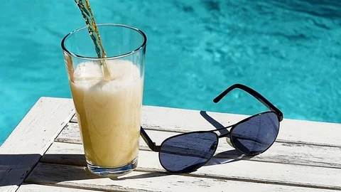 Beer at the pool Stockbeeldmateriaal 77993434