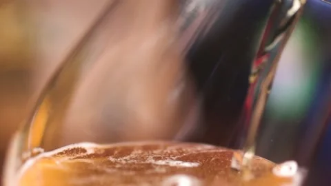 Beer pour into glass slow motion close Medium shot Stock Footage 229968554