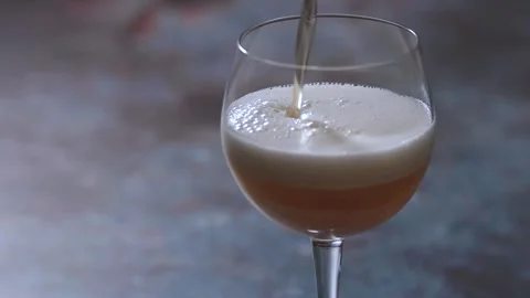 Beer poured from above Stock Footage 244570878