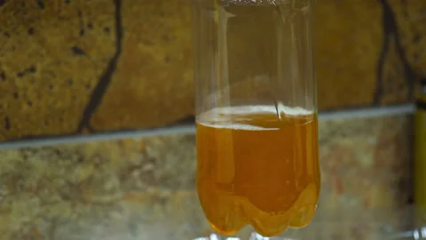 The beer is poured into the bottle Stock Footage 85896565