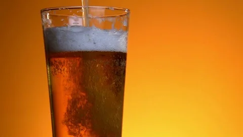 Beer poured in glass on background Stock Footage 73920535