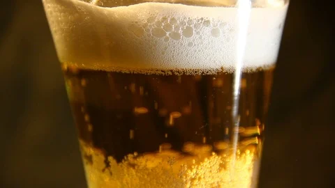 Beer poured into a glass with bubble Stock Footage 70283286