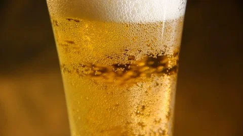 Beer poured into a glass with bubble Stock-Footage 70283734