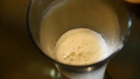 Beer poured into a glass with bubble Stock Footage 70283803