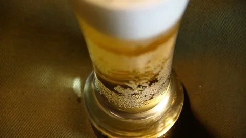 Beer poured into a glass with bubble Stock Footage 70283972