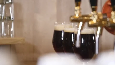 Beer is poured into a glass Stock Footage 83589752