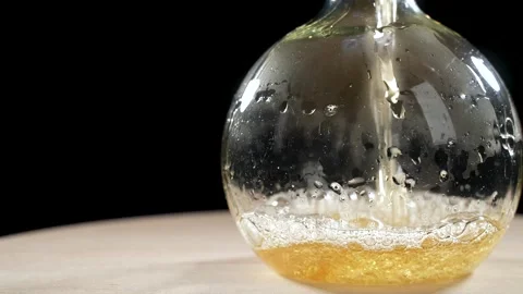 Beer is poured into a glazed laboratory flask. slow motion Video stock 249177101