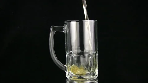 Beer is poured in a mug Stock Footage 106484770
