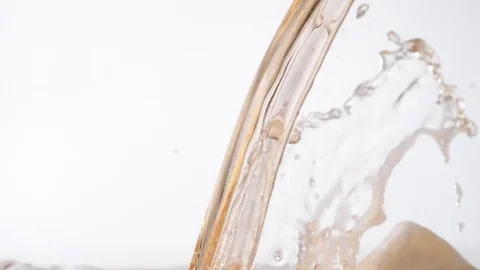 Beer pouring and bouncing. Slow Motion. Stock Footage 72863893