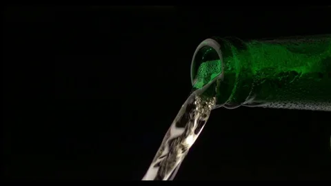 Beer Pouring From Bottle Stockbeeldmateriaal 81796132