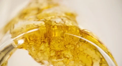 Beer is pouring in Glass from Bottom View Extremely closeup Slow motion Stock Footage 103642884