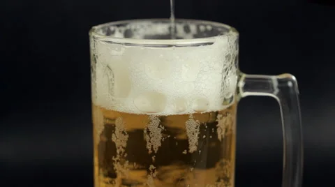 Beer is pouring into the glass. Bubbles Stock Footage 58199746