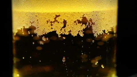 Beer is pouring into the glass. Bubbles Stock Footage 63226443